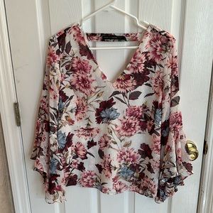 Floral blouse size 8 see though arms.  Ruffles.  Lined.